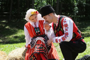 Vratsa, Bulgaria - June 24, 2018: People in traditional authentic folk costumes, recreating the traditional Bulgarian northern wedding on National folklore fair 