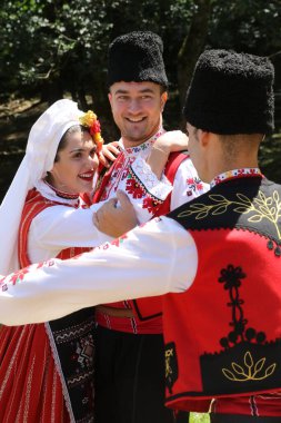 Vratsa, Bulgaria - June 24, 2018: People in traditional authentic folk costumes, recreating the traditional Bulgarian northern wedding on National folklore fair 