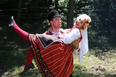 Vratsa, Bulgaria - June 24, 2018: People in traditional authentic folk costumes, recreating the traditional Bulgarian northern wedding on National folklore fair 