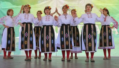 Vratsa, Bulgaria - June 24, 2018: People in traditional authentic folk costumes, recreating the traditional Bulgarian northern wedding on National folklore fair 