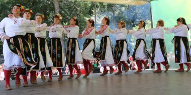 Vratsa, Bulgaria - June 24, 2018: People in traditional authentic folk costumes, recreating the traditional Bulgarian northern wedding on National folklore fair 
