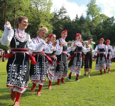 Vratsa, Bulgaria - June 24, 2018: People in traditional authentic folk costumes, recreating the traditional Bulgarian northern wedding on National folklore fair 
