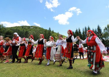 Vratsa, Bulgaria - June 24, 2018: People in traditional authentic folk costumes, recreating the traditional Bulgarian northern wedding on National folklore fair 