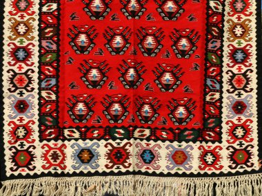 Hand-woven carpet with ethnic and folk pattern clipart
