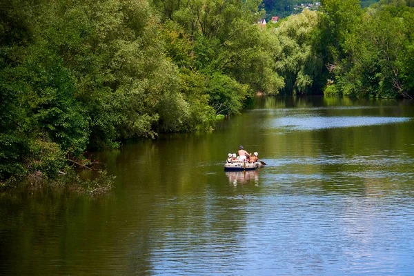 rubber boat with people on the river