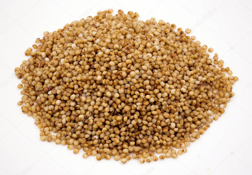 Close-up of kodo millet grains on an isolated white background