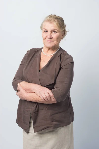 Portrait of an old woman on a white background