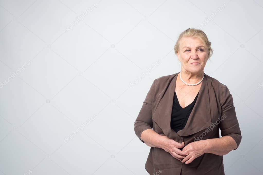 Portrait of an old woman on a white background