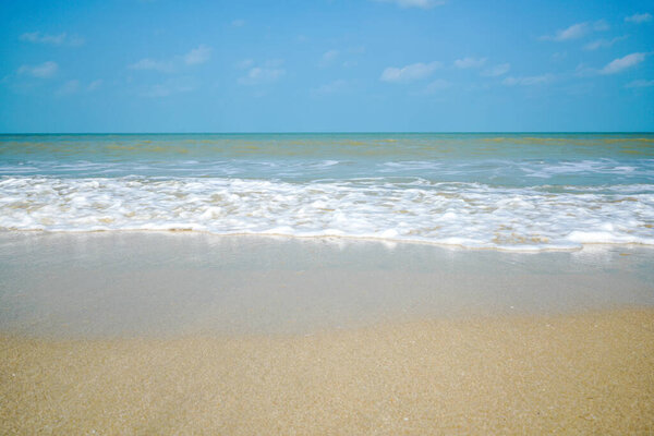 Beach and sand with water wave. Sea foam. Sea wave. Nature background.