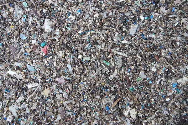 Micro plastics marine debris on the sand beach.