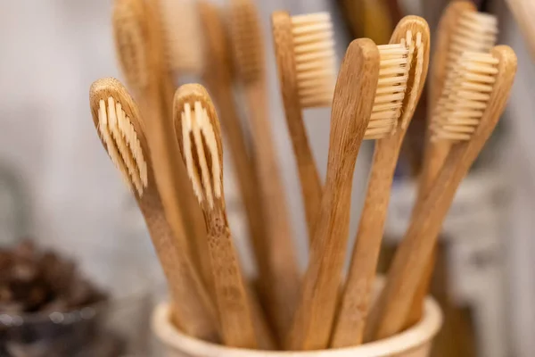 Bamboo toothbrush in zero waste shop. Eco friendly biodegradable toothbrush.