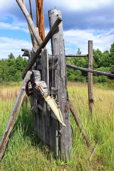 Bow arrows quiver hanging on the wood log