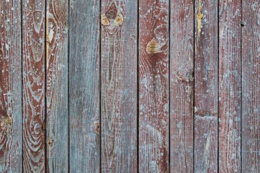 Duvarın ahşap döşemeleri ya da ahşap yapının döşemeleri. Koyu kahverengi renklerde kesilmiş dalların izleri olan düğümler ve lekeler. Doğal desenli ahşap arka plan.