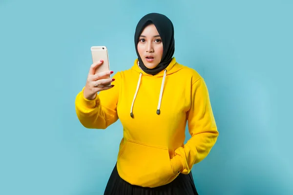 asian women with shocked and wow face expression smartphone on isolated background