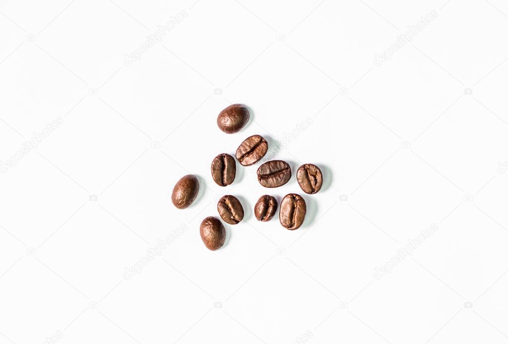 Closeup shot of coffee beans on white background. Seed nature from above view. Group agriculture grain arabica. Photos from the top view.