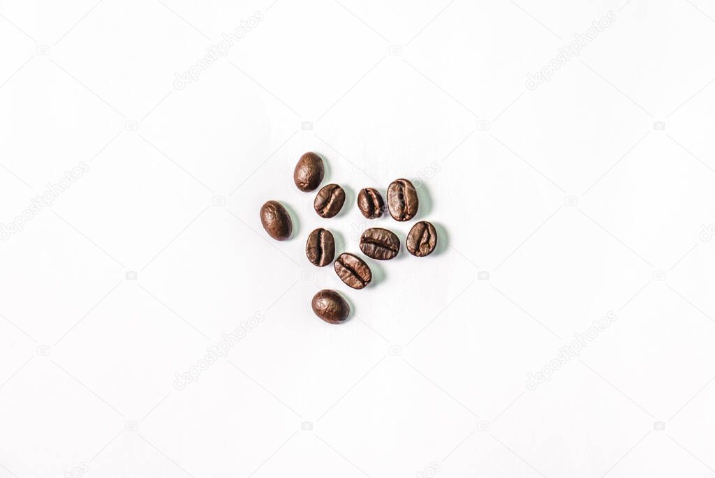 Closeup shot of coffee beans on white background. Seed nature from above view. Group agriculture grain arabica. Photos from the top view.