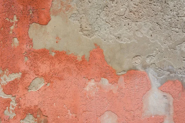 Background weathered red paint of concrete wall