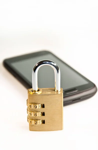 Padlock and smartphone on white background