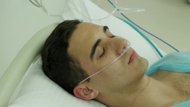 Close Patient Lying Intensive Care Oxygen Tube His Nose — Stock Video