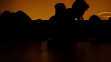 people come to life on a yellow background. Silhouettes