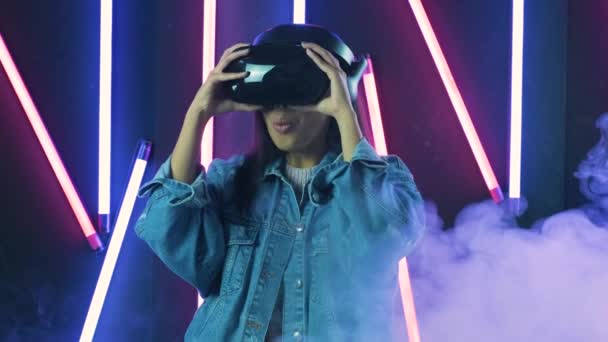 Young Woman Puts Headset Wonders How Amazing World Virtual Reality — Stock Video