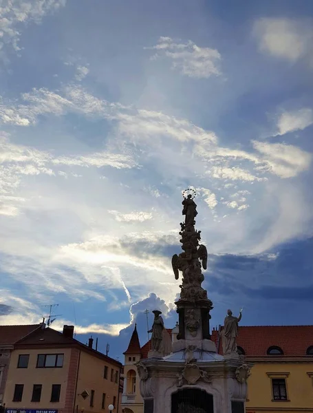 Marian plague column sculpture on evening lighting sky background. Town Uherske Hradiste, Czech republic.