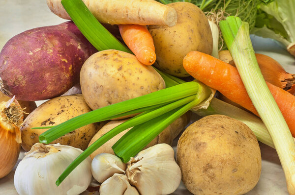 Group of vegetable on white kitchen board