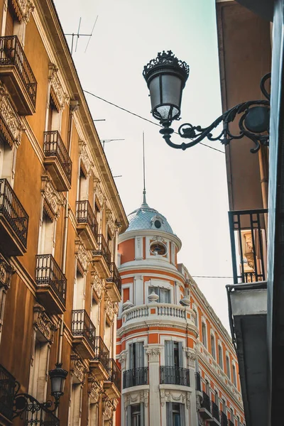 Spain Tourism: Street view and building with Hanging Street Lamps in Alilcante, Spain