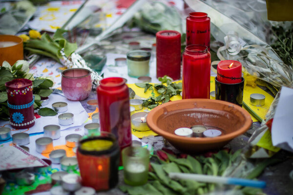 Brussels/Belgium - March 24 2016: Candles and flowers. The day after the terrorist attacks on 23 March 2016. Citizens of Brussels mourning for the victims