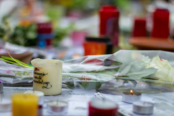 Brussels/Belgium - March 24 2016: Candles and flowers: The day after the terrorist attacks on 23 March 2016. Citizens of Brussels mourning for the victims