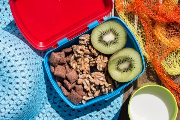 breakfast to go with cereal, fruit, and nuts. Kiwi and walnuts.
