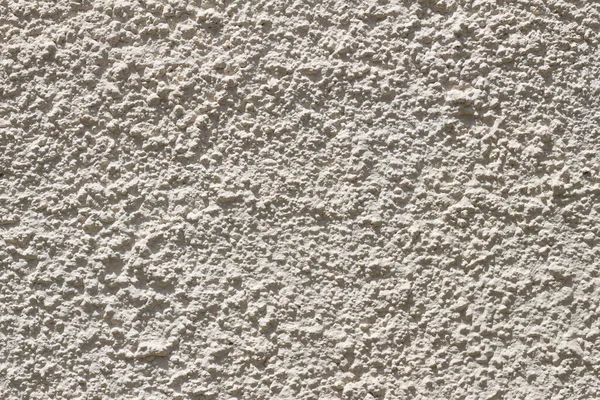 Exterior wall stuccoed with cement. Fat grain texture.