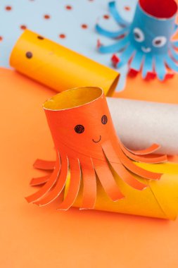 octopus made with the roll of toilet paper. Crafts with recycled material. clipart