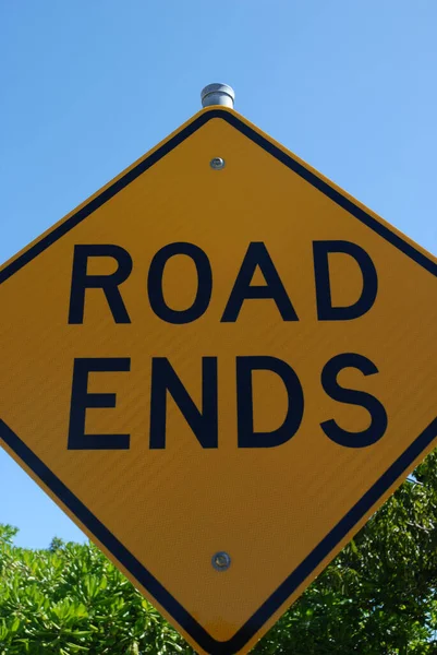 Yellow diamond shaped road sign with the words Road Ends, Magnetic Island Queensland, Australia