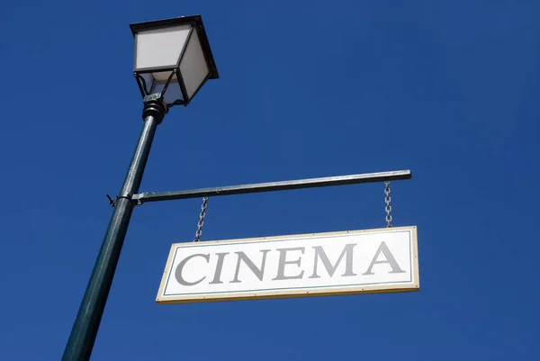 Old Fashioned Cinema Sign Hanging Lamp Post Blue Sky Historic — Stock Photo, Image