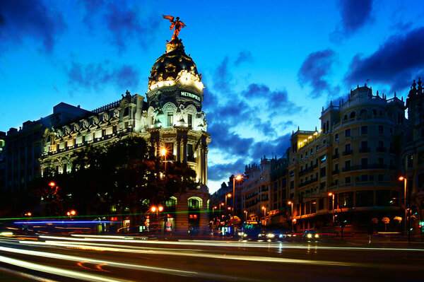 View of the Metropolis Building in the evening in the center of Madrid