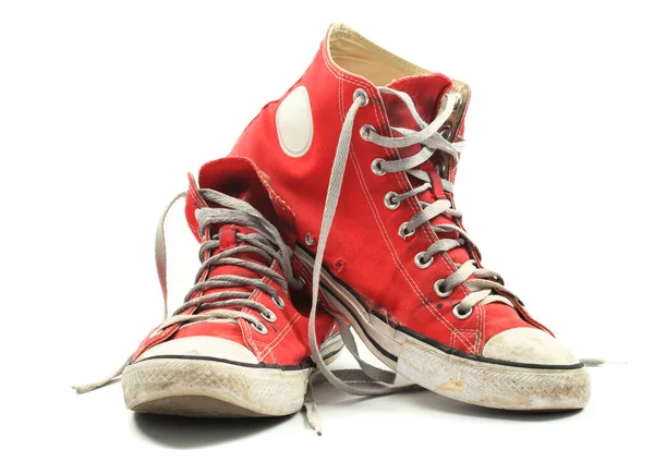 Old Dirty Red Canvas Sneakers Isolated White Stock Image