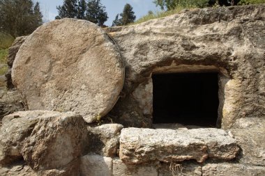 A tomb near nazareth, Israel dates to the first century. Similar to Christ's tomb with the stone rolled over the entry. clipart