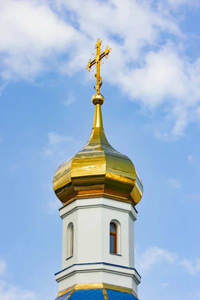 Golden dome of the Church of Elijah the Prophet in Butovo (Moscow) against the sky