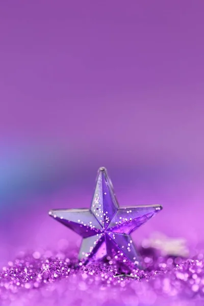 Christmas background. star on glitter blurry background