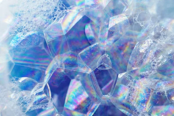 Soap foam macro background.blue texture of soap foam close-up