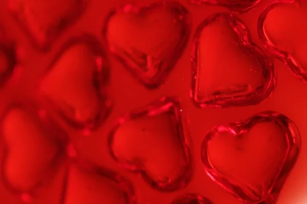 red hearts, candies background close up