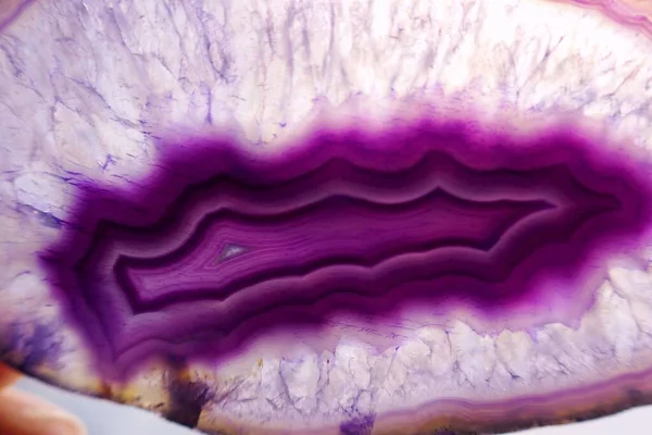 Agate, stone, violet background