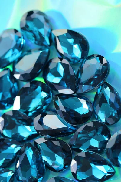 Aqua Menthe shiny background.Turquoise beads on a turquoise background