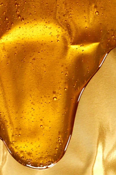 Miód Kapie Złotym Tle Tekstura Miodu — Zdjęcie stockowe
