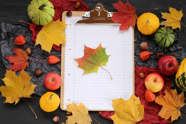 Autumn mockup.empty clipboard, notepad with colored maple leaf
