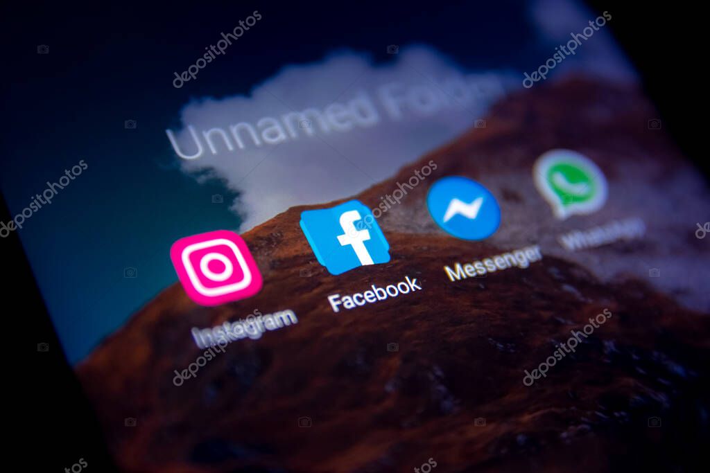 Facebook, instagram, whatsapp and messenger icons on the phone screen