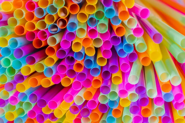 Close up to plenty colorful straws background