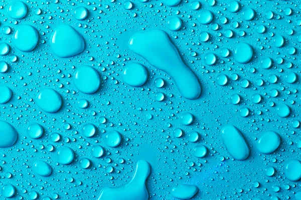 Druppels Water Een Blauw Glas Textuur Achtergrond — Stockfoto