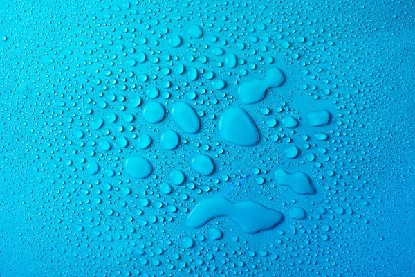 Gocce Acqua Uno Sfondo Vetro Blu — Foto Stock